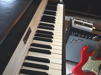 A Fender Rhodes electric piano, a Fender Blender effects pedal, a Fender Twin Reverb amplifier and a Fender Stratocaster electric guitar