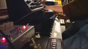 A Korg MS-20 synthesizer and a Korg CX-3 organ being played