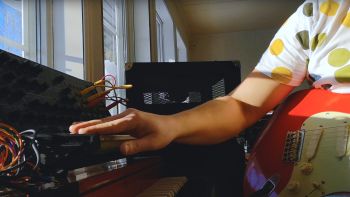 A Korg MS-20 and a red Fender Stratocaster electric guitar