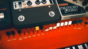 Red Yamaha YC-25D combo organ with effects pedals on top