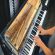 A Fender Rhodes electric piano being played