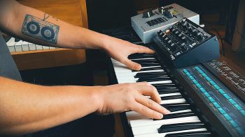 A Yahama DX7 with an Elektron SidStation and a Moog Minitaur on top being played