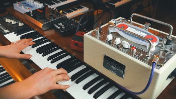 A Korg CX-3 organ with effects units on top being played