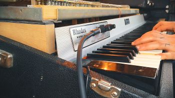 A Fender Rhodes electric piano being played