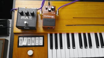A Hohner Clavinet D6 with a Pro Co RAT 2 distortion and a Boss OC-2 Octaver pedal on top