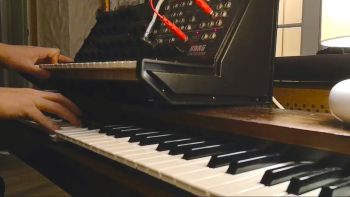 A Korg MS-20 synthesizer and a Korg CX-3 organ being played