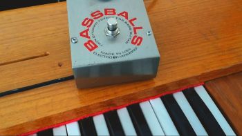A Hohner Clavinet D6 with an Electro-Harmonix Bassballs pedal on top