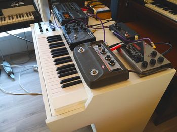 A Mellotron M4000D in custom cabinet with effects pedals on top