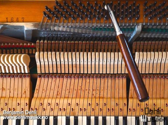Piano with a tuning wrench