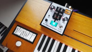 A Hohner Clavinet D6 with a Dr Freakenstein Fuzz DrFF-3 pedal on top